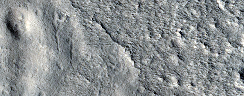 Layered Feature in Crater in Galaxias Fossae
