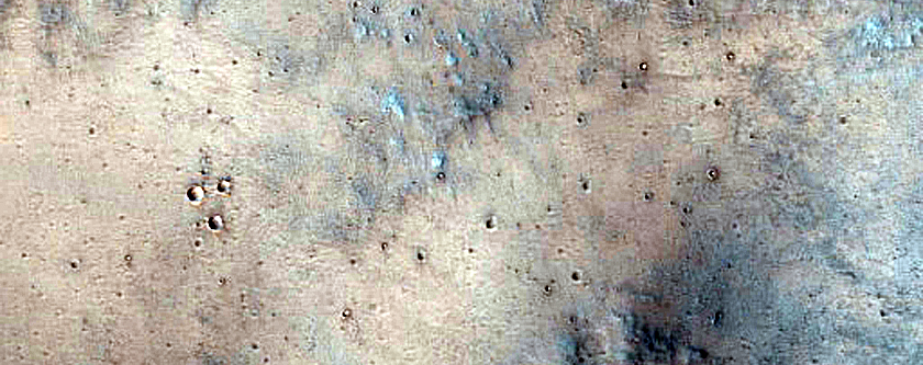 Possible Layering Under Ejecta in Syria Planum