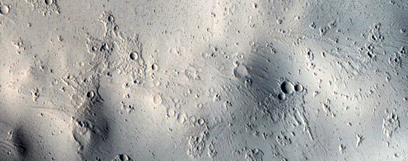 Flow Features and Crater on Tombaugh Crater Rim