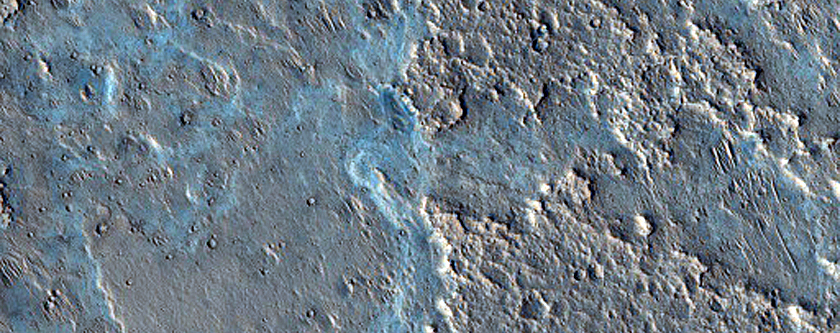 Fan-Shaped Deposit with Floor Outcrop in Camichel Crater