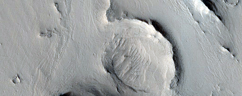 Layered Deposits in Crater in Arabia Region
