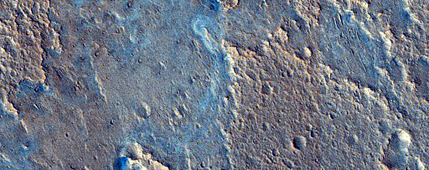 Fan-Shaped Deposit with Floor Outcrop in Camichel Crater