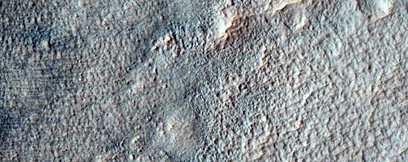 Parallel Ridges in Thaumasia Fossae Crater