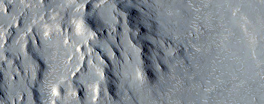 Valley Cutting Ejecta of Crater and Associated Sinuous Ridge