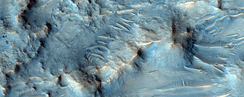Channel Cutting Rim of Crater in Tyrrhena Terra