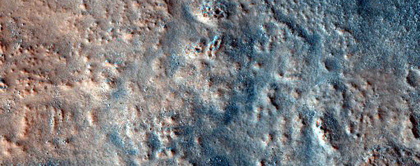 Eroded Layers in Crater in Coloe Fossae