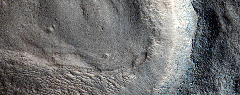 Layered Feature in Crater West of Semeykin Crater