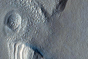 Layered Structure and Depression on Rim of Moreux Crater