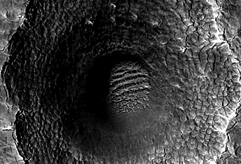 A Crater Enlarged by the Sublimation of Ice