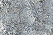 Dipping Layers in Crater and Depression in Deuteronilus Mensae