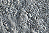 Mid-Latitude Crater with Concentric Ridges in Ejecta