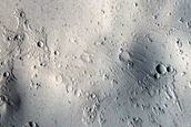 Flow Features and Crater on Tombaugh Crater Rim