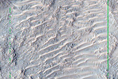 Colorful Exposures on Rim of 12-Kilometer Crater North of Hellas Planitia