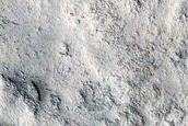 Fan-Shaped Feature with Sinuous Ridges near Rim of Antoniadi Crater