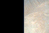 Light-Toned Layered Material in Depression in West Juventae Chasma