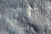 Channel near Crater in Northern Mid-Latitudes