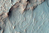 Flat Layered Deposits and Candidate Exit Breach in Small Young Crater