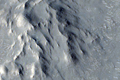 Valley Cutting Ejecta of Crater and Associated Sinuous Ridge