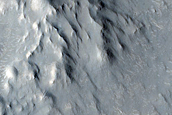 Valley Cutting Ejecta of Crater and Associated Sinuous Ridge