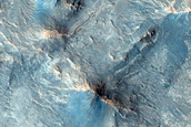 Phyllosilicate-Rich Central Pit and Landslide in Tyrrhena Terra