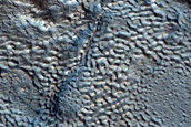 Dipping Layers in Depressions in Deuteronilus Mensae