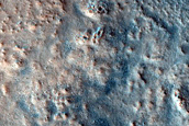 Eroded Layers in Crater in Coloe Fossae