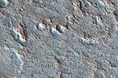 Channel Incision Exposing Layered Deposits in Sagan Crater