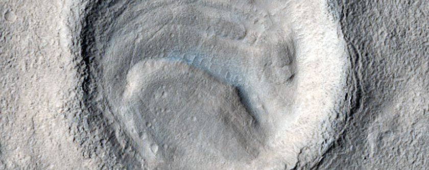 Layered Feature in Crater in Southern Mid-Latitudes