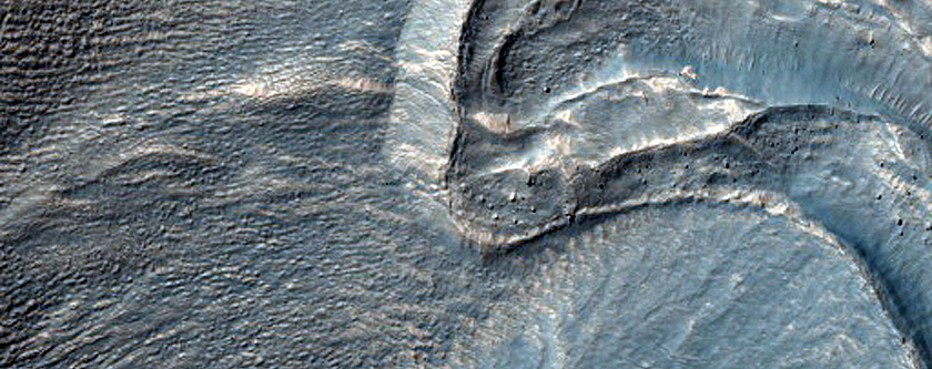 Gully Interactions with Small Craters on Wall of Larger Crater