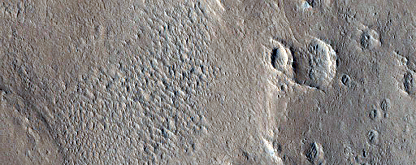 Valley-Channel Transitions in Crater in Arabia Terra