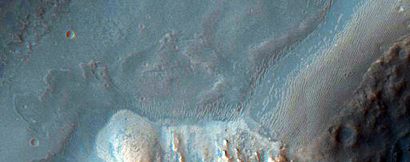 Crater on Floor of 35-Kilometer Diameter Crater East of Thaumasia Planum