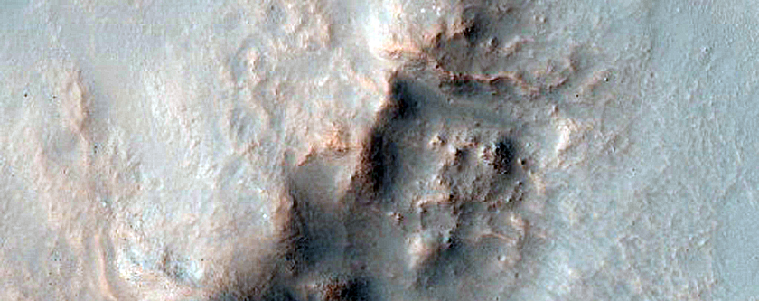 Impact Crater Exposing Bedrock