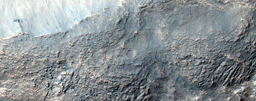 Dipping Layers along Rim of Crater near Reull Vallis