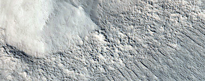Crater into Debris Covered Glacier with Visible Internal Layering