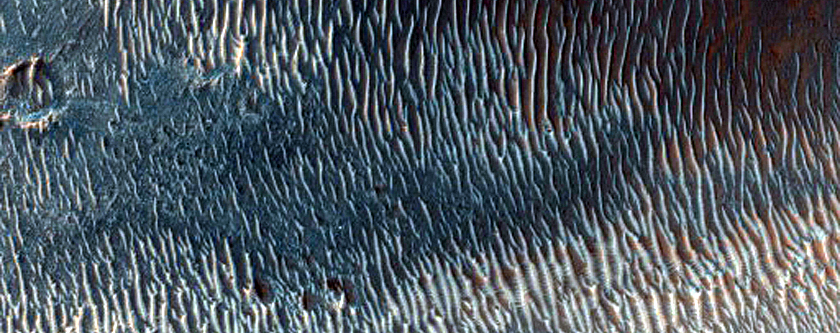 Valley Cutting through Crater Rim in Tyrrhena Terra
