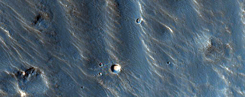 Small Channels in Claritas Fossae