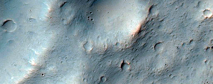 Breach in Central Pit of Crater and Possible Layer Exposure in nearby Fan