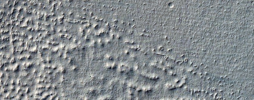 Crater with Exposed Rock and Gullies