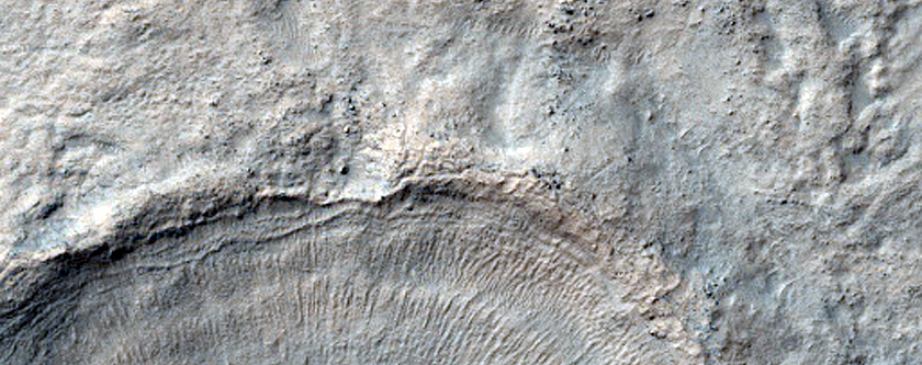 Layered Feature in Fresh Crater in Hellas Planitia
