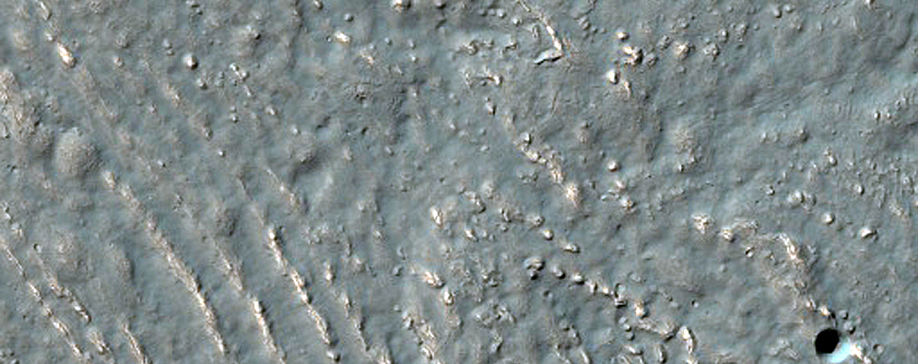 Southern Mid-Latitude Crater with Fill in Claritas Fossae