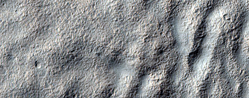 Possible Mountain Glacier Features near Reull Vallis