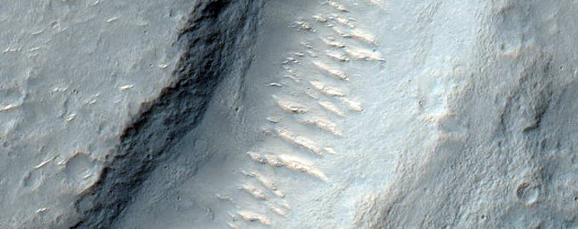 Channel Interacting with Small Craters in Hesperia Planum