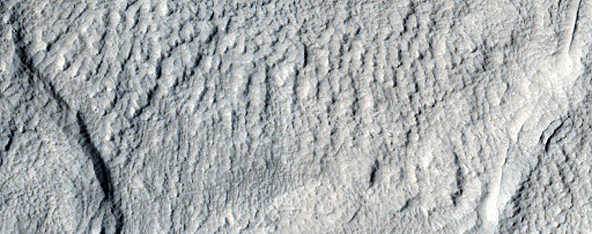 Crater Infill and Possible Chasm near Phlegra Montes