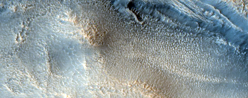 Layered Feature in Crater and Mantle on Mounds in Northern Mid-Latitudes
