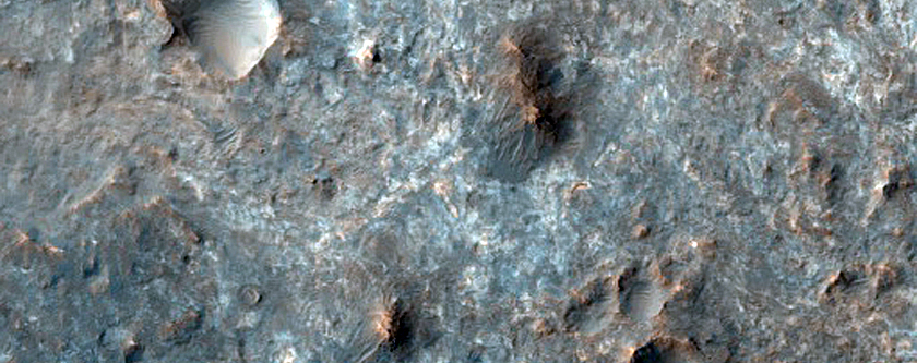 Mawrth Vallis Dark-Toned Cap Associated with Well-Preserved Crater Ejecta 