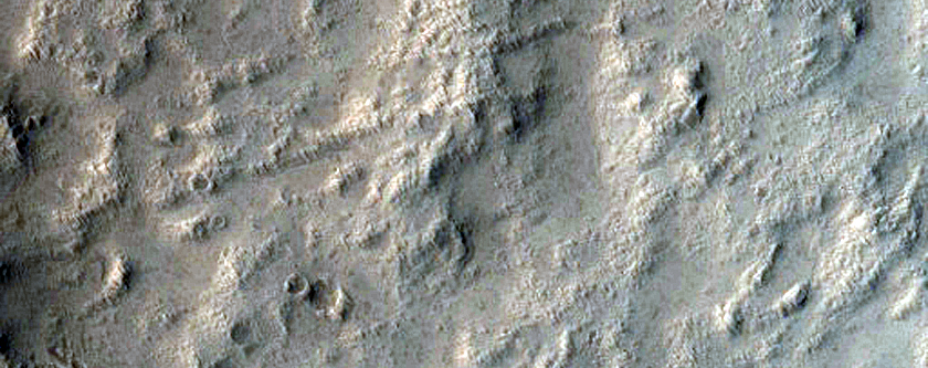 Partial Icy Fill of Impact Crater onto Graben