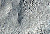 Sinuous Ridge and Channel Through Ice Rich Terrain