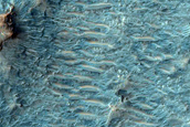 Surface Exposures West of 12-Kilometer Crater Rim North of Hellas Planitia