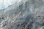 Dipping Layers along Rim of Crater near Reull Vallis