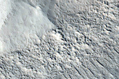 Crater into Debris Covered Glacier with Visible Internal Layering